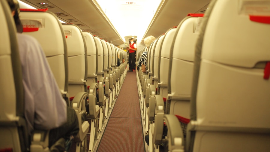 Traveler wearing headphones on airplane looking out window during flight