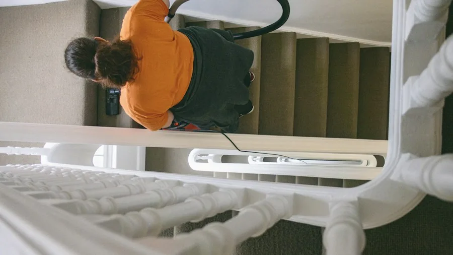 vacuuming stairs with handheld attachment