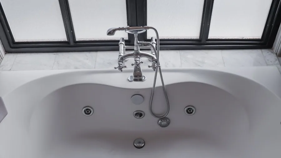 Water splashing in a clean bathtub during shower, demonstrating waterproofing and moisture control in bathroom
