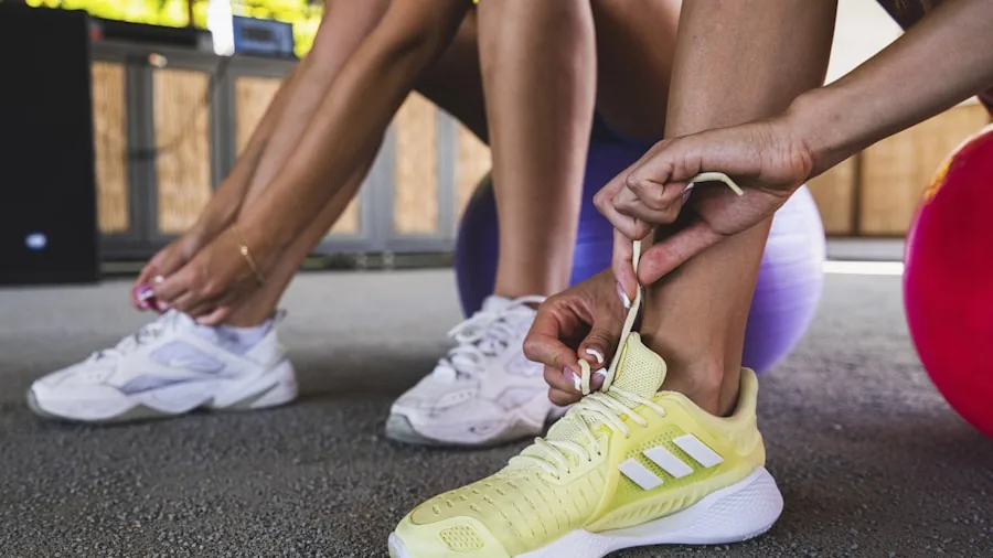 Woman adjusting and testing athletic shoe fit while seated, checking comfort and sizing