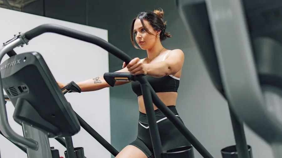 Woman adjusting elliptical machine settings in home gym during workout session