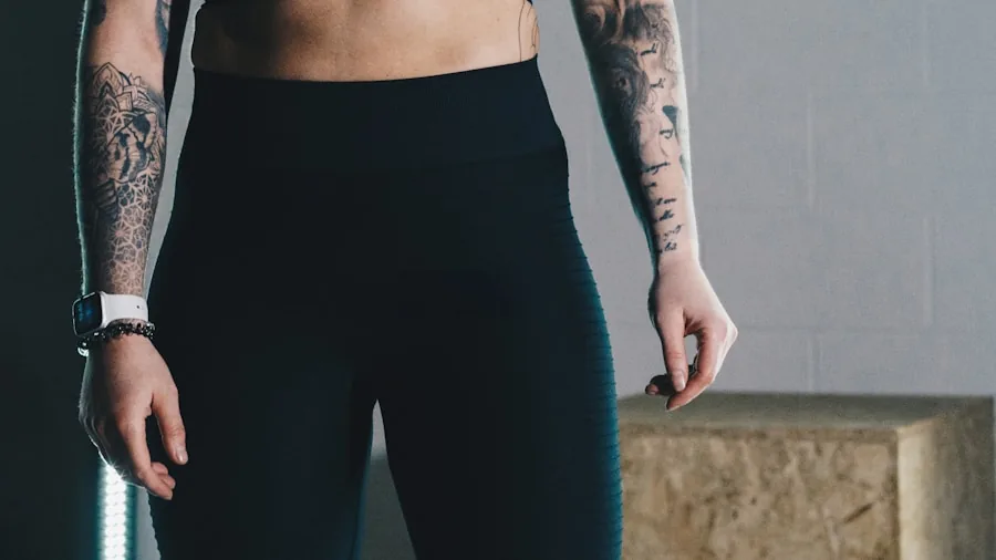 The %product_count% Best Leggings for Women 5 Woman checking fit of leggings in mirror during shopping decision process