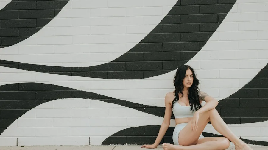 5 Hill Workout Routines to Prepare for Steep Mountain Hikes 3 woman doing wall sits against wall