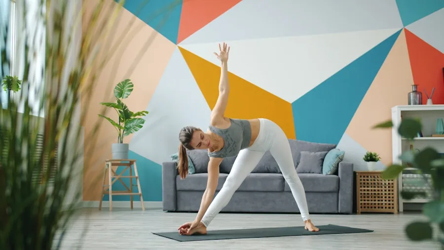 The %product_count% Best Yoga Pants 3 Woman in high-waisted yoga pants performing a stretch pose during an indoor yoga session
