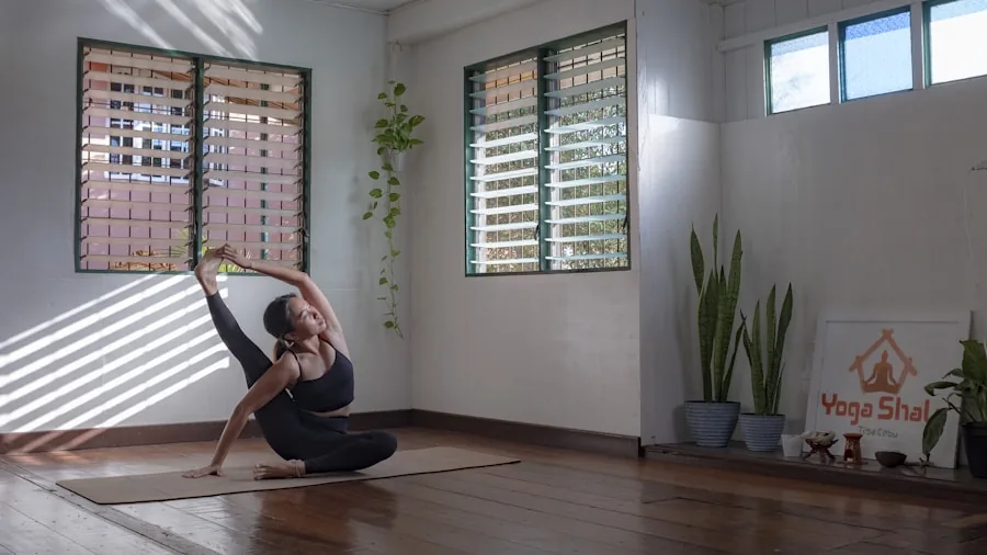 The %product_count% Best Yoga Pants 2 Woman in yoga pose stretching in bright studio with natural sunlight