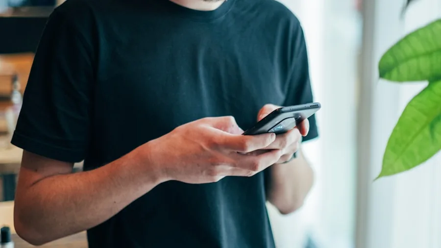 Woman reviewing workout data on smartphone screen during home fitness session