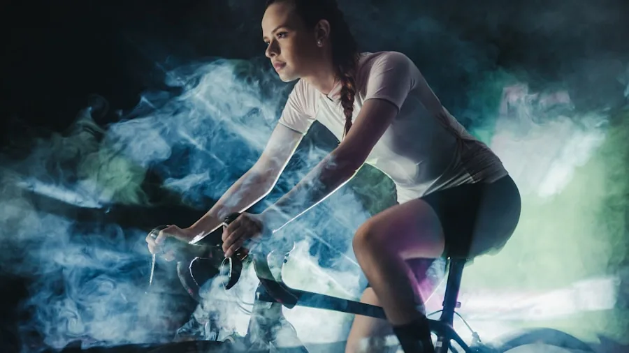 Woman riding stationary exercise bike in home gym with focused expression during workout