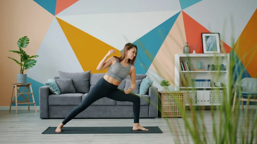 Woman using elliptical machine in bright apartment, focused on workout routine at home