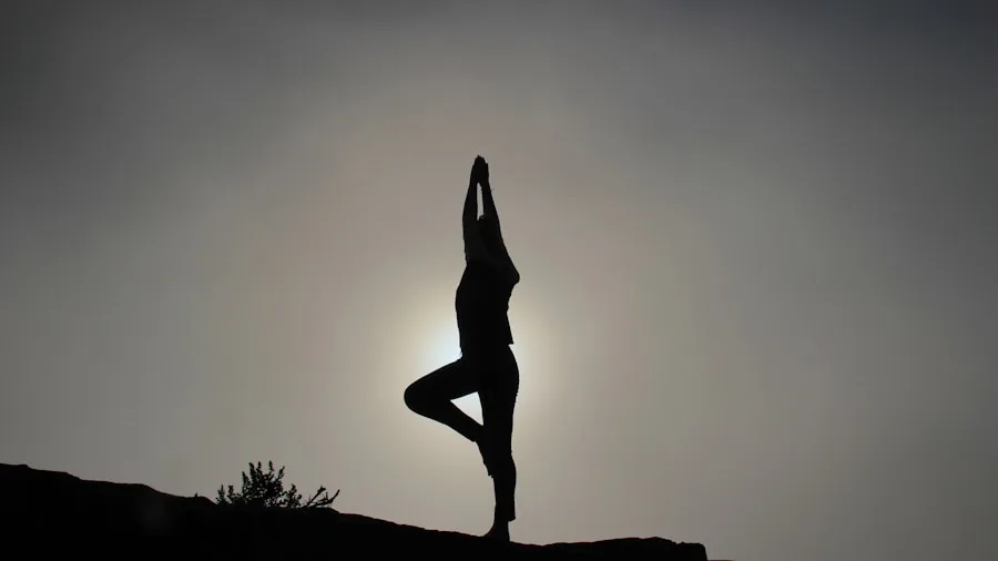 Yoga practitioner performing a standing balance pose on a mat indoors