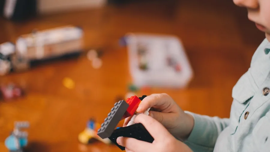 Young child constructing with colorful building blocks, focused on creative play and learning through hands-on building activities